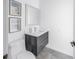 Stylish half bathroom features modern vanity, sleek fixtures, and contemporary decor for a chic and functional space at 2314 Floyd St, Sarasota, FL 34239