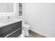 Contemporary half-bathroom with a minimalist design and modern fixtures at 2314 Floyd St, Sarasota, FL 34239