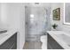 Stylish bathroom featuring dual sinks, glass shower, and neutral palette at 2314 Floyd St, Sarasota, FL 34239