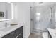 Modern bathroom with double sinks, LED mirror, and glass shower at 2314 Floyd St, Sarasota, FL 34239
