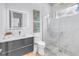 Modern bathroom with a sleek vanity, illuminated mirror, and glass-enclosed shower creating a spa-like experience at 2314 Floyd St, Sarasota, FL 34239