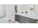 Contemporary bathroom with dual sinks, a spacious glass shower, and sleek finishes creating a luxurious and functional space at 2314 Floyd St, Sarasota, FL 34239