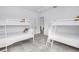 bedroom features two bunkbeds, ample light, and tile floors at 2314 Floyd St, Sarasota, FL 34239
