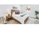 Cozy bedroom with a wooden bed frame and decorative pillows with bedside tables and lamps at 2314 Floyd St, Sarasota, FL 34239