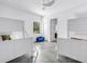 room featuring bunk beds, a blue chair and light tile flooring at 2314 Floyd St, Sarasota, FL 34239