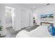 Bright bedroom with modern décor, light walls, TV, and en suite bathroom at 2314 Floyd St, Sarasota, FL 34239