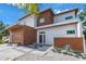 Stylish contemporary home featuring a clean exterior with wood accents, landscaped front yard, and a modern design at 2314 Floyd St, Sarasota, FL 34239
