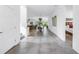 Spacious hallway featuring an open layout with views into the dining, living, and bedroom areas, offering a cohesive living space at 2314 Floyd St, Sarasota, FL 34239
