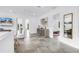 Hallway view of upstairs living room with television and entryways to bedrooms at 2314 Floyd St, Sarasota, FL 34239