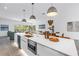Spacious kitchen island features a built-in microwave and copper sink, seamlessly connecting to the dining area at 2314 Floyd St, Sarasota, FL 34239