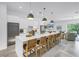 Modern kitchen with a long island, barstool seating, and an open layout to the living area at 2314 Floyd St, Sarasota, FL 34239