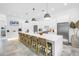 Contemporary kitchen featuring white cabinets, a large island, and stainless steel appliances at 2314 Floyd St, Sarasota, FL 34239