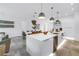 Bright and spacious kitchen with a large island and modern appliances open to the dining area at 2314 Floyd St, Sarasota, FL 34239