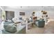 Bright, open living space featuring modern furnishings and decor adjacent to dining and kitchen area at 2314 Floyd St, Sarasota, FL 34239