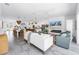 Open-concept living space with a modern kitchen, dining area, and cozy seating arrangement at 2314 Floyd St, Sarasota, FL 34239