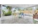 Bright sunroom with large windows, chairs, and a view of the backyard at 3205 33Rd Street W Ct, Bradenton, FL 34205