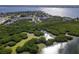 Beautiful aerial view of coastal real estate with lush mangroves surrounding at 3409 10Th W Ln, Palmetto, FL 34221