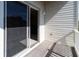 Balcony with sliding glass door, outdoor lighting, and wooden deck at 3409 10Th W Ln, Palmetto, FL 34221