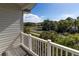 This covered balcony has a beautiful view of the neighborhood trees at 3409 10Th W Ln, Palmetto, FL 34221