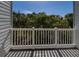 Balcony view of tropical trees and a clear blue sky with a white railing at 3409 10Th W Ln, Palmetto, FL 34221