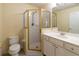 Bright bathroom featuring a shower with gold frame and classic vanity with a toilet at 3409 10Th W Ln, Palmetto, FL 34221