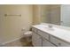 Bathroom with large mirror, white vanity, toilet, and tan ceramic tile at 3409 10Th W Ln, Palmetto, FL 34221