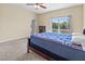 Bedroom with carpet, ceiling fan, dresser and sliding glass door to a balcony at 3409 10Th W Ln, Palmetto, FL 34221