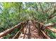 Wooden boardwalk surrounded by lush greenery and trees at 3409 10Th W Ln, Palmetto, FL 34221