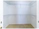Walk-in closet with metal shelving and neutral carpet at 3409 10Th W Ln, Palmetto, FL 34221