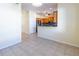 Open-concept kitchen with stainless steel appliances and adjacent dining area, hardwood style flooring at 3409 10Th W Ln, Palmetto, FL 34221