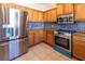 This beautiful kitchen has stainless steel appliances, beautiful countertops, and plenty of cabinet storage at 3409 10Th W Ln, Palmetto, FL 34221