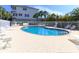 Enjoy the community pool and lounge area surrounded by lush landscaping and a secure fence at 3409 10Th W Ln, Palmetto, FL 34221