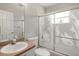 Bathroom featuring a shower-tub combo with swan-themed etched glass doors and white vanity at 3415 68Th Street E Cir, Palmetto, FL 34221