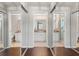 Bright bathroom featuring double mirrored closets and a vanity with generous counter space at 3415 68Th Street E Cir, Palmetto, FL 34221