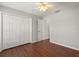 Bedroom with wood flooring, closet, and neutral walls at 3415 68Th Street E Cir, Palmetto, FL 34221