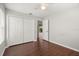 Bedroom with wood flooring, closet, and neutral walls at 3415 68Th Street E Cir, Palmetto, FL 34221