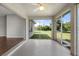 Enclosed lanai with sliding doors that connects to a living area and provides views of the backyard at 3415 68Th Street E Cir, Palmetto, FL 34221