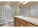 Bathroom featuring a vanity with a sink, shower-tub combo and a large mirror at 3707 45Th W Ter # 104, Bradenton, FL 34210