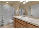 Bright bathroom featuring a vanity with a sink, shower-tub combo and a large mirror at 3707 45Th W Ter # 104, Bradenton, FL 34210