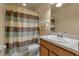 Well-lit bathroom with a shower-tub combo, stylish vanity, and neutral color scheme at 3707 45Th W Ter # 104, Bradenton, FL 34210