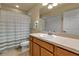 Bathroom featuring a vanity with a sink, shower-tub combo and a large mirror at 3707 45Th W Ter # 104, Bradenton, FL 34210