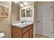 Bright bathroom featuring a vanity with sink, mirrored backsplash, and a linen closet at 3707 45Th W Ter # 104, Bradenton, FL 34210