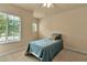 Bedroom featuring a single bed with a large window providing plenty of natural light at 3707 45Th W Ter # 104, Bradenton, FL 34210