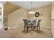 Formal dining room features a glass table with four chairs and chandelier at 3707 45Th W Ter # 104, Bradenton, FL 34210
