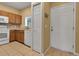 Kitchen featuring tile flooring, oak cabinets, window view and white appliances at 3707 45Th W Ter # 104, Bradenton, FL 34210