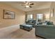Bright living room with neutral walls, comfortable seating, and natural light creates a welcoming atmosphere at 3707 45Th W Ter # 104, Bradenton, FL 34210