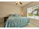 Comfortable main bedroom with a window view and soft colors creates a peaceful retreat at 3707 45Th W Ter # 104, Bradenton, FL 34210