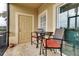 Balcony with table and chairs and views of trees at 3707 45Th W Ter # 104, Bradenton, FL 34210