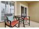 Balcony has small table and chairs with cushioned seating at 3707 45Th W Ter # 104, Bradenton, FL 34210