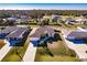 Spacious single-story home with an attached garage, mature landscaping, and a lush green lawn at 3835 W Price Blvd, North Port, FL 34286